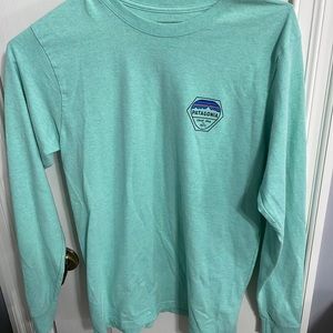 patagonia long sleeve tee… it is more of an aqua color and it is pretty long.